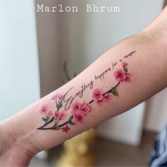 a woman's arm with pink flowers and the words, you are happy to someone