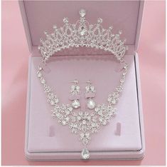 a tiara and earrings in a pink box