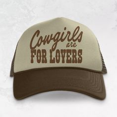 Show of your style in our Cowgirls are for Lovers trucker hat.- Features the phrase "Cowgirls are for Lovers" across the front in a brown ink- Come with a removable small brown 1 inch button attached to each hat- Individually heat pressed onto each hat- 5 Panel, Mesh Back with Snap Back*due to screens & filters colors may vary slightly to photos* Retro Brown Trucker Hat With Letter Print, Vintage Brown Trucker Hat With Letter Print, Brown Trucker Hat For Western-themed Events, Brown Trucker Baseball Cap With Letter Print, Brown Trucker Hat With Letter Print, Adjustable Brown Baseball Cap With Letter Print, Adjustable Brown Trucker Hat With Letter Print, Brown Adjustable Trucker Hat With Letter Print, Brown Trucker Hat For Country Events