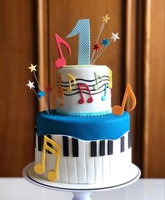 a birthday cake decorated with musical notes and stars