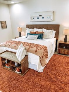 a large bed sitting on top of a carpet covered floor