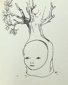 a drawing of a child's head in front of a tree with no leaves