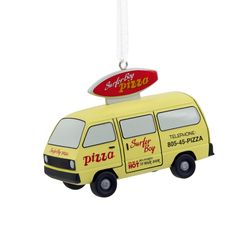 a yellow van ornament with a pizza sign on it's roof hanging from a string