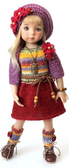 a doll wearing a colorful dress and hat