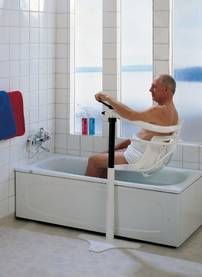 a man sitting in a bathtub with his feet up