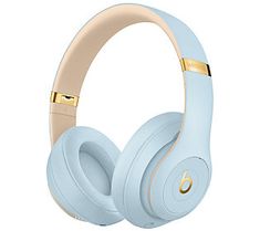 the beats on - ear headphones are light blue and have gold trimmings