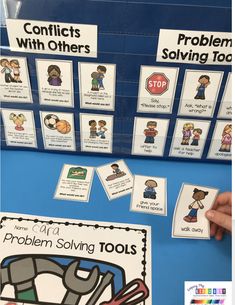 a table with posters and other items for problem - solvers to help students understand the problem