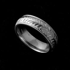 a wedding ring with an intricate design on it