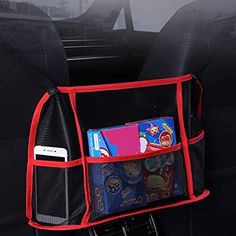 the back pocket of a car with books and magazines in it, hanging from the front seat