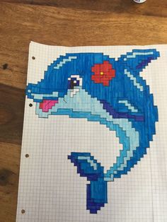 a piece of paper with an image of a blue dolphin on it and a cup of coffee next to it