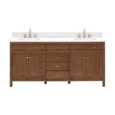 a double sink vanity with two gold faucets on the top and white counter tops