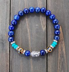 Bracelet Mala- Lapis Lazuli Buddha Bohemian Beaded Bracelets With Silver Beads For Meditation, Adjustable Lapis Lazuli Beaded Bracelets For Meditation, Adjustable Lapis Lazuli Stretch Bracelet With Round Beads, Blue Polished Beads Spiritual Stretch Bracelet, Spiritual Blue Stretch Bracelet With Polished Beads, Blue Spiritual Stretch Bracelet For Meditation, Flexible Spiritual Beaded Bracelet With Round Beads, Symbolic Adjustable Stretch Bracelet With Round Beads, Blue Spiritual Stretch Bracelet With Round Beads