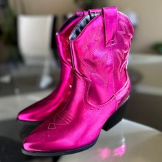 Show Off Your Love For Country Style With These Trendy Cowgirl Booties! Crafted From Faux Leather With Detailed Stitch Accents For An Authentic, Yet Modern Look. Its Pointed Toe Adds A Timeless Silhouette, While The Synthetic Out-Sole And Stacked Heel Provide Comfort And Durability. Easy On And Off Pull Tabs Complete The Design. Condition: Brand New Color: Magenta Heel Height: 2.75" Fit: True To Size (M) Trendy Purple Boots For Spring, Pink Round Toe Booties For Fall, Trendy Pink Ankle Booties, Trendy Purple Ankle-high Boots, Purple Ankle Boots For Spring, Pink Western Ankle-high Boots, Pink Ankle-high Western Boots, Pink Ankle-high Booties For Fall, Pink Ankle Booties For Fall