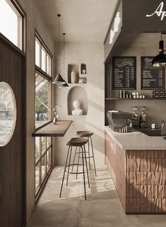 the interior of a coffee shop with stools and tables