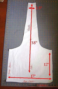 an apron is shown on a cutting board with the measurements for it to be cut