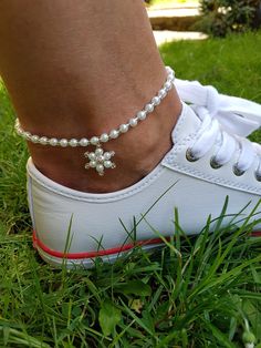 Beautiful hanging flower anklet made with white pearls and tiny silver glass beads. Simple, elegant and casual, especially loved on the beach and summer outdoor activities. Perfect match for open toed and sports shoes.  Circumference is 23 cm with 1 cm extension chain. The anklet is also stretchable. Adjustable Pearl Anklets For Summer, Adjustable Silver Pearl Anklets, Adjustable Pearl Charm Anklets For Summer, White Pearl Anklets For Summer, Summer White Pearl Anklets, Dainty White Wedding Anklets, White Anklets For Summer Gifts, Adjustable Silver Anklets With Pearl Chain, White Anklets With Pearl Charm As Gift