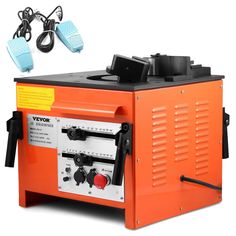 an orange and black machine sitting on top of a white surface