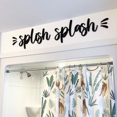 a shower curtain with the word splash on it