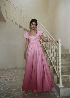 $299 Elegant A-line Maxi Dress With Smocked Bodice, Feminine Party Maxi Dress With Empire Waist, Pink Empire Waist Dress For Prom, Pink Empire Waist Prom Dress, Pink Prom Dress With Ruched Back, Empire Waist Fitted Dress For Gala, Fitted Empire Waist Dress For Gala, Empire Waist Gala Dress, Elegant Pink Dress With Ruched Back