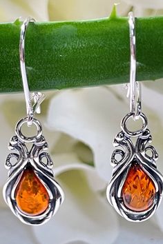 Classic Amber Sterling Silver Earrings, Orange Drop Earrings For Anniversary, Classic Amber Earrings For Gift, Elegant Amber Sterling Silver Earrings, Orange Teardrop Sterling Silver Earrings, Elegant Nickel-free Orange Earrings, Elegant Orange Sterling Silver Earrings, Elegant Orange Nickel-free Earrings, Orange Teardrop Anniversary Jewelry