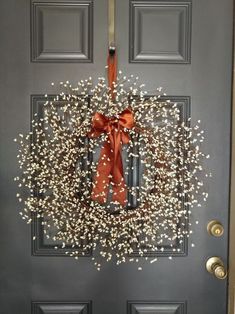 a door with a wreath and bow on it