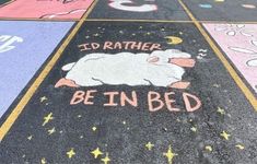 the pavement has been painted with chalk and stars, which says i'd rather be in bed