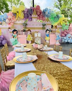 a table set up for a princess birthday party