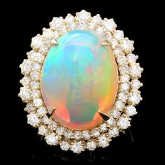 12.50 Carats Natural Impressive Ethiopian Opal and Diamond 14K Solid Yellow Gold Ring The opal has beautiful fire, pictures don't show the whole beauty of the opal! Suggested Replacement Value: Approx. $8,800.00 Total Natural Opal Weight is: Approx. 10.50 Carats Opal Measures: Approx. 13 x 8mm Total Natural Round Diamonds Weight: Approx. 2.00 Carats (color G-H / Clarity SI1-SI2) Ring total weight: Approx. 10.0 grams Disclaimer: all weights, measurements and colors are approximate and may vary sl Fire Pictures, Antique Opal Ring, Jewelry Design Drawing, Opal Ring Gold, Jewelry Appraisal, Jewelry Accessories Ideas, Etsy Gold Ring, Opal Color, I Love Jewelry