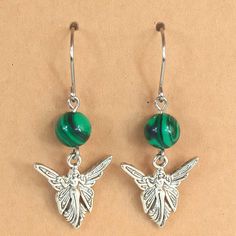 Malachite and Fairy dangle drop earrings Handcrafted 1.75" long including ear wires Stainless Steel ear wires,silver plated charms 1636-P17 Handcrafted Artisan Jewelry, Artisan Jewelry, Ear Wires, Silver Plate, Silver Plated, Dangle Drop Earrings, Jewelry Watches, Hand Crafted, Jewelry Earrings