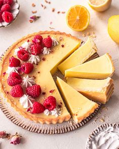 a lemon tart with raspberries on top