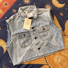 Uo Renewal Raw Cropped Denim Vest Size M/L Brand Is “Guess Jeans” As Shown On The Front Of The Vest. Nwt Unique Vintage Piece Updated With A Raw Cut Hem. This Modern Design Was Created By Urban Renewal From Unique Vintage And Deadstock Items Found Around The World. Spring Light Wash Cropped Denim Vest, Spring Cropped Light Wash Denim Vest, Cropped Cotton Denim Blue Vest, Cropped Denim Blue Cotton Vest, Summer Cropped Medium Wash Outerwear, Summer Cropped Outerwear In Medium Wash, Trendy Light Wash Denim Vest With Buttons, Casual Cropped Denim Vest With Buttons, Medium Wash Cropped Denim Vest With Pockets