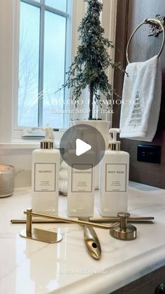 an image of a bathroom setting with soap and lotion bottles on the counter top