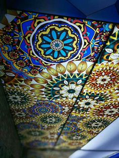 the ceiling is decorated with many colorful designs