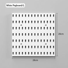 the white pegboard is shown with measurements