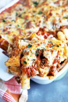 a casserole dish filled with meat and cheese