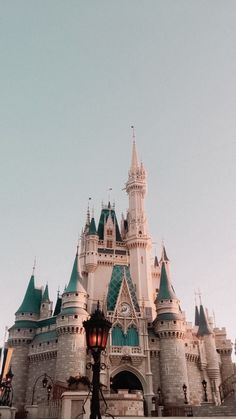 a large castle with many towers and lights