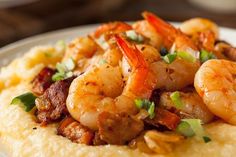 a plate with shrimp and grits on it