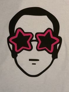 a white shirt with pink stars on the front and black glasses on the back,