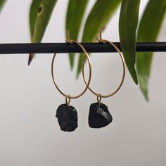 ✨ Golden, waterproof stainless steel hoop earrings with small, raw black tourmalines. ✨ Each tourmaline is lovingly handcrafted into a pendant and finally a high-quality creole. The size of the gemstones varies between 8-10 mm. Since these are natural stones, no two crystals are the same, each one is unique. ♥ The diameter of the hoop earrings is 2 cm. The hoop earrings are simply hooked together for easy opening and closing. 2 pieces per sale. ☼ To charge your crystal it can be placed in sunlig Nickel-free Black Huggie Jewelry, Black Nickel-free Huggie Jewelry, Black Pierced Huggie Jewelry, Nickel-free Small Hoop Black Jewelry, Black Nickel-free Hoop Earrings As Gift, Nickel-free Black Hoop Earrings Gift, Nickel Free Black Hoop Earrings Gift, Black Stainless Steel Hoop Earrings As Gift, Black Nickel-free Small Hoop Jewelry