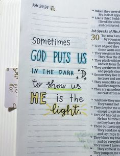 an open bible with the words god puts us in the dark to show us he is the light