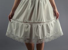 "Lightweight Ivory Cotton Lawn Petticoat - 100% Cotton Slimline waistband with narrow elasticated waist (Made to Order, please choose from Options) - if you want a larger size please convo us Lace Insertion part way down skirt (can be made with or without - please choose from Options) - Lace is polyester/Nylon depending upon current stock Wide Edging Lace (Approx 2.5\") to hem (Lace trim may vary but if you would like us to send a photo of the one currently in use just convo us) Finally choose y Lace Insertion, Lace Slip, Satin Material, Way Down, Lace Edging, Petticoat, Long Skirt, I Dress, White Lace