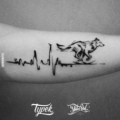 a black and white photo of a heartbeat tattoo with a horse on it's arm