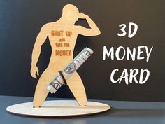 a wooden cutout of a man holding a baseball bat with the words, shut up and take the money card