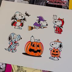 some stickers on the side of a white paper with dogs and jack - o'- lanterns