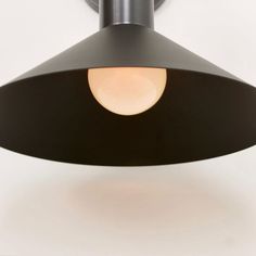 a black light fixture with a white background