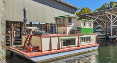 a house boat is docked at the dock