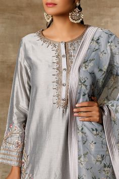 Grey kurta with placement floral motifs. Comes with sharara pants and printed dupatta.
Components: 3
Fabric: Chanderi, Organza
Neckline: Round
Sleeve Length: Full
Color: Grey
Printed, Embroidered
Dupatta with tassels
Laced border
Closure: Kurta: Front buttons - Aza Fashions Grey Kurta, Sharara Pants, Kurta Sharara Set, Kurta Sharara, Printed Dupatta, Embroidered Dupatta, Sharara Set, Lace Border, Floral Motifs