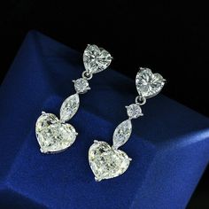 Specification:- Stone Details :- *Diamond Material : Cubic Zirconia / Moissanite ( As Per Order ) *Diamond Shape : Heart, Marquise & Round Cut *Total Diamond Weight : 7.00 CT (Approx.) *Diamond Dimension : 3.00, 6.00, 6*3, 9.00 MM *Diamond Color : White *Diamond Clarity: VVS *Certificate : AGL ASIA (ONLINE) *Making Process: Handmade by our Experienced Staff. *Stamp: Our All Rings Stamped According to metal Purity (925 SIL/10K/14K/18K). Customization:- *Buyer can Request change of rhodium color i Diamond Earrings Wedding, Wedding Earring, Heart Shaped Diamond, Garnet Earrings, Fashion Jewelry Earrings, Diamond Drops, 925 Silver Jewelry, Drop Earring, High Jewelry