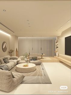 a living room filled with furniture and a flat screen tv mounted to the side of a wall