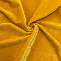 a close up view of a yellow velvet fabric with very thin lines on the edges